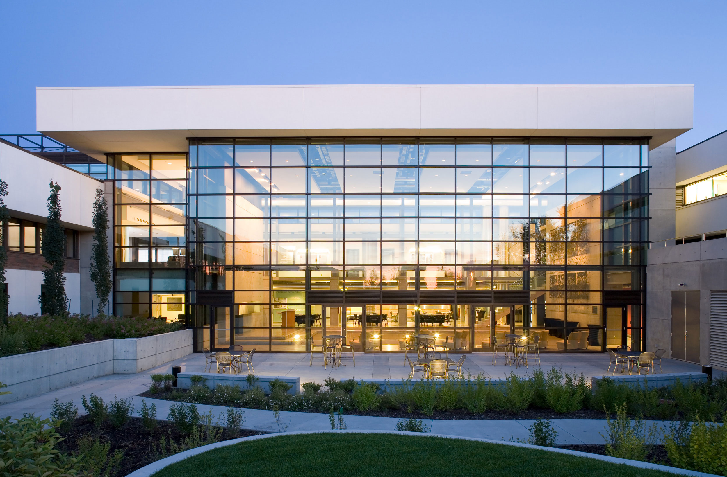 Twilight photo of glass facade of PCL Construction in Canada