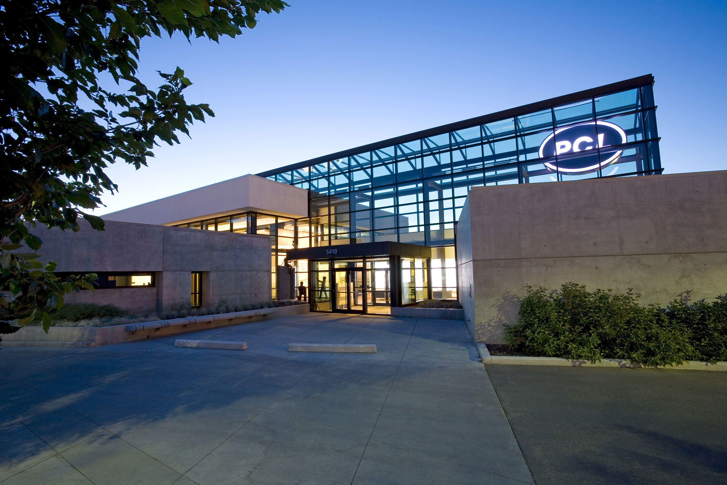 Twilight photo of enterance at PCL Construction in Canada
