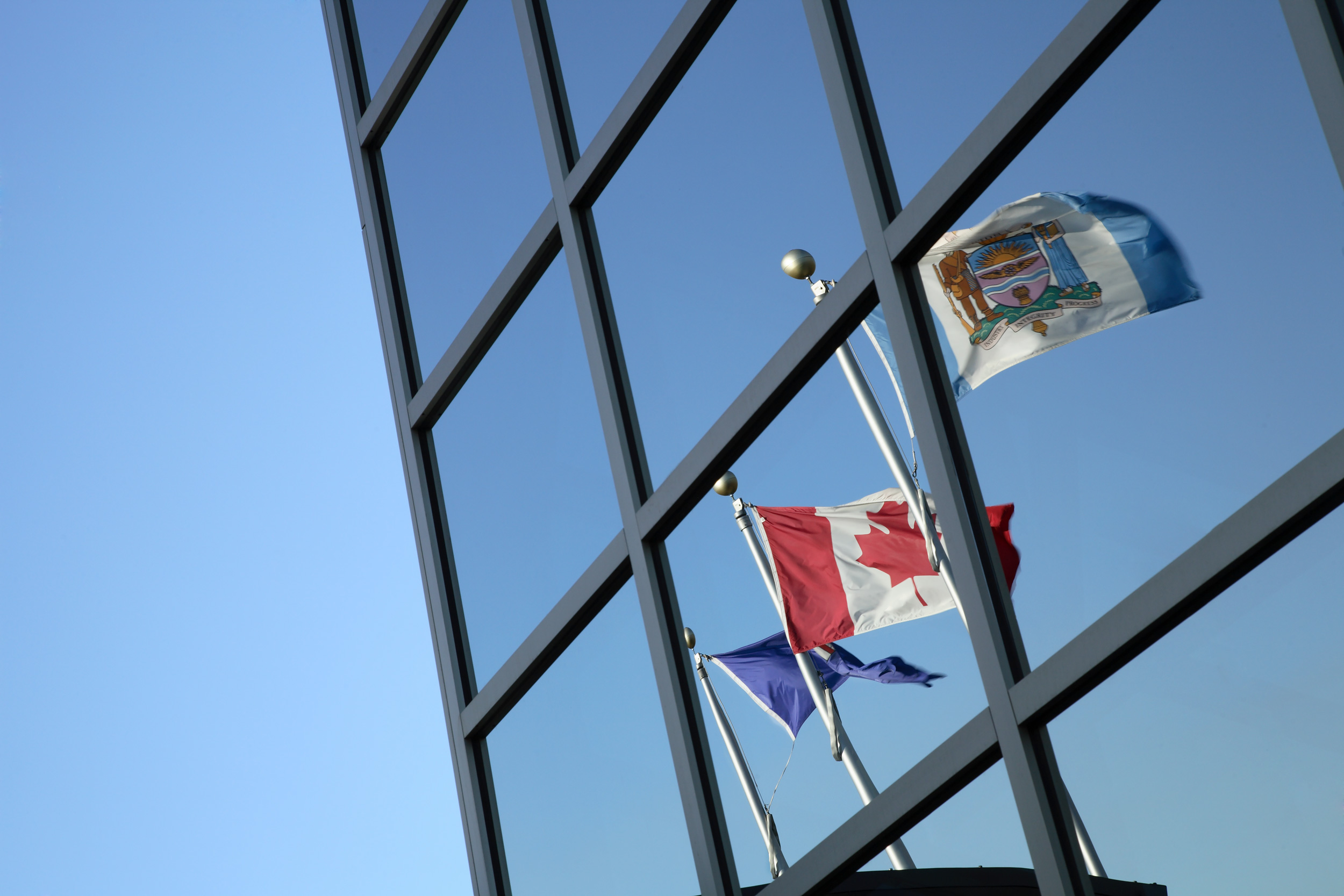 Reflection of flags in windows at Edmonton Police Service