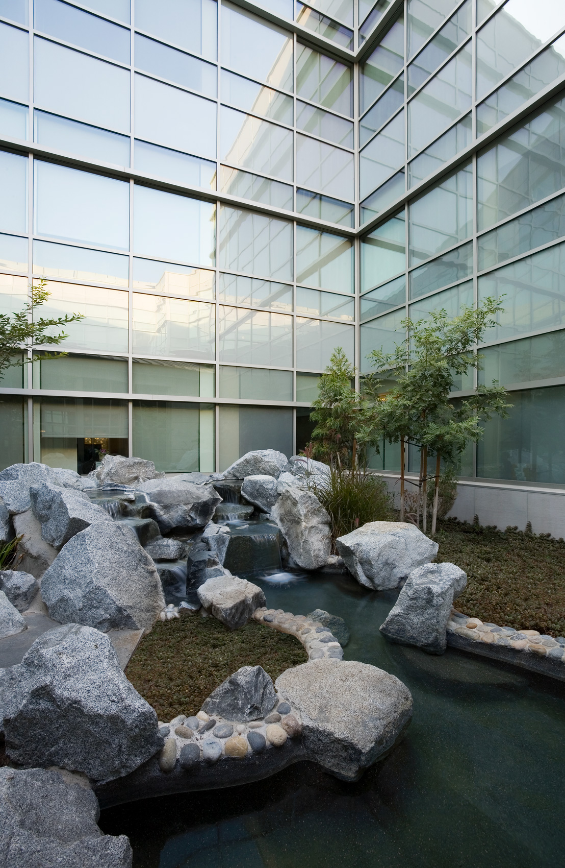 Tranquil interior garden with waterfall in CA Court building