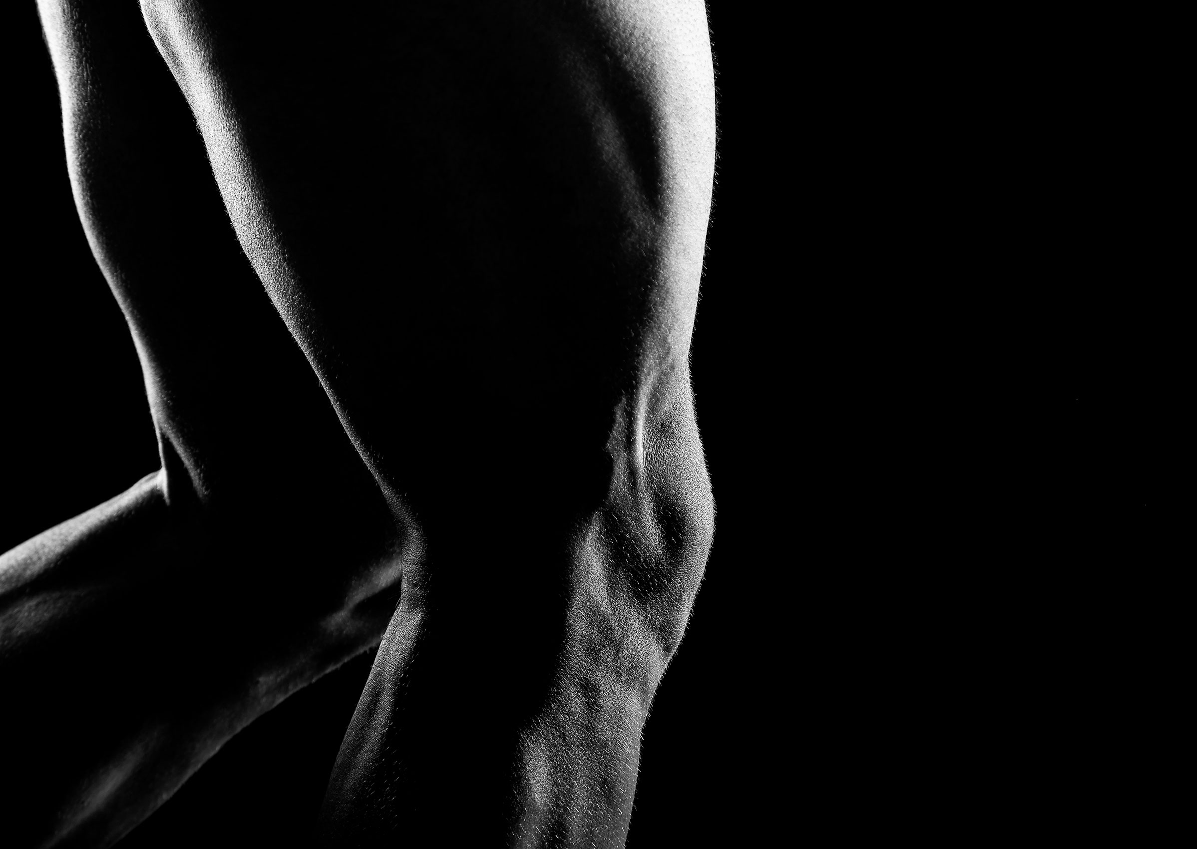 High contrast of sexy naked male athlete